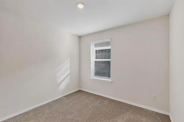 a view of empty room with windows