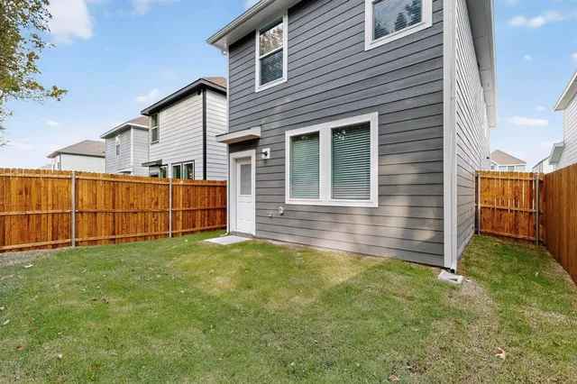a view of backyard with small cabin