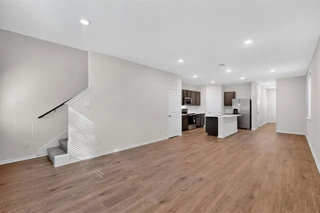 a view of kitchen with wooden floor