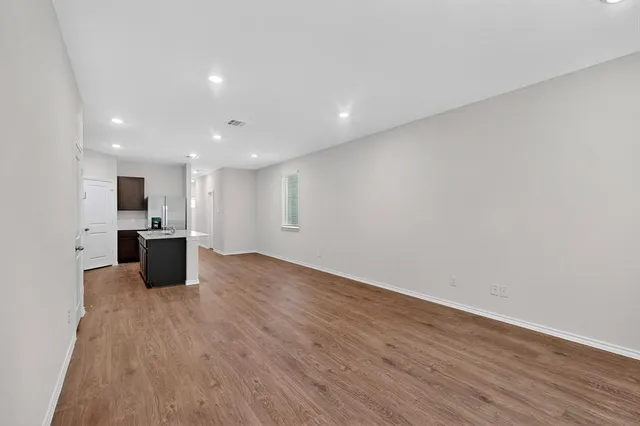 a view of a kitchen with a sink and a microwave
