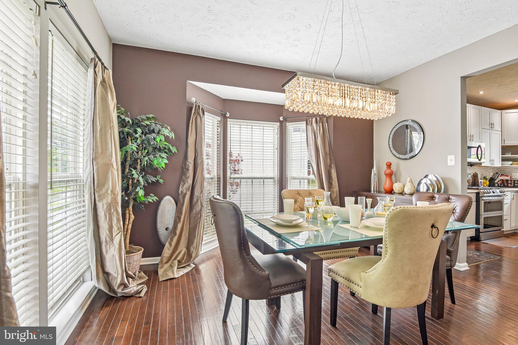 306 Watertons Way Joppa, MD 21085 - Photo 16 of 50 a view of a dining room with furniture window and wooden floor