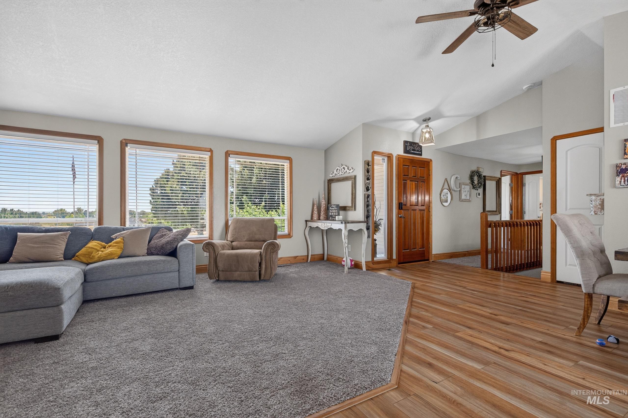9696 Gloria Road Middleton, ID 83644 - Photo 7 of 50 Spacious open-concept living area featuring a vaulted ceiling with a ceiling fan