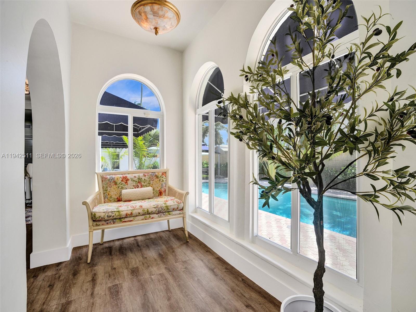 1128 Tyler Street Hollywood, FL 33019 - Photo 16 of 60 a living room with furniture and a large window