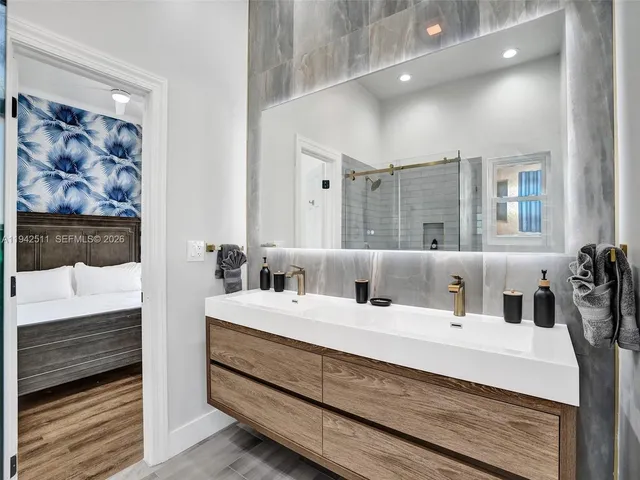 a spacious bedroom with a bed and a window