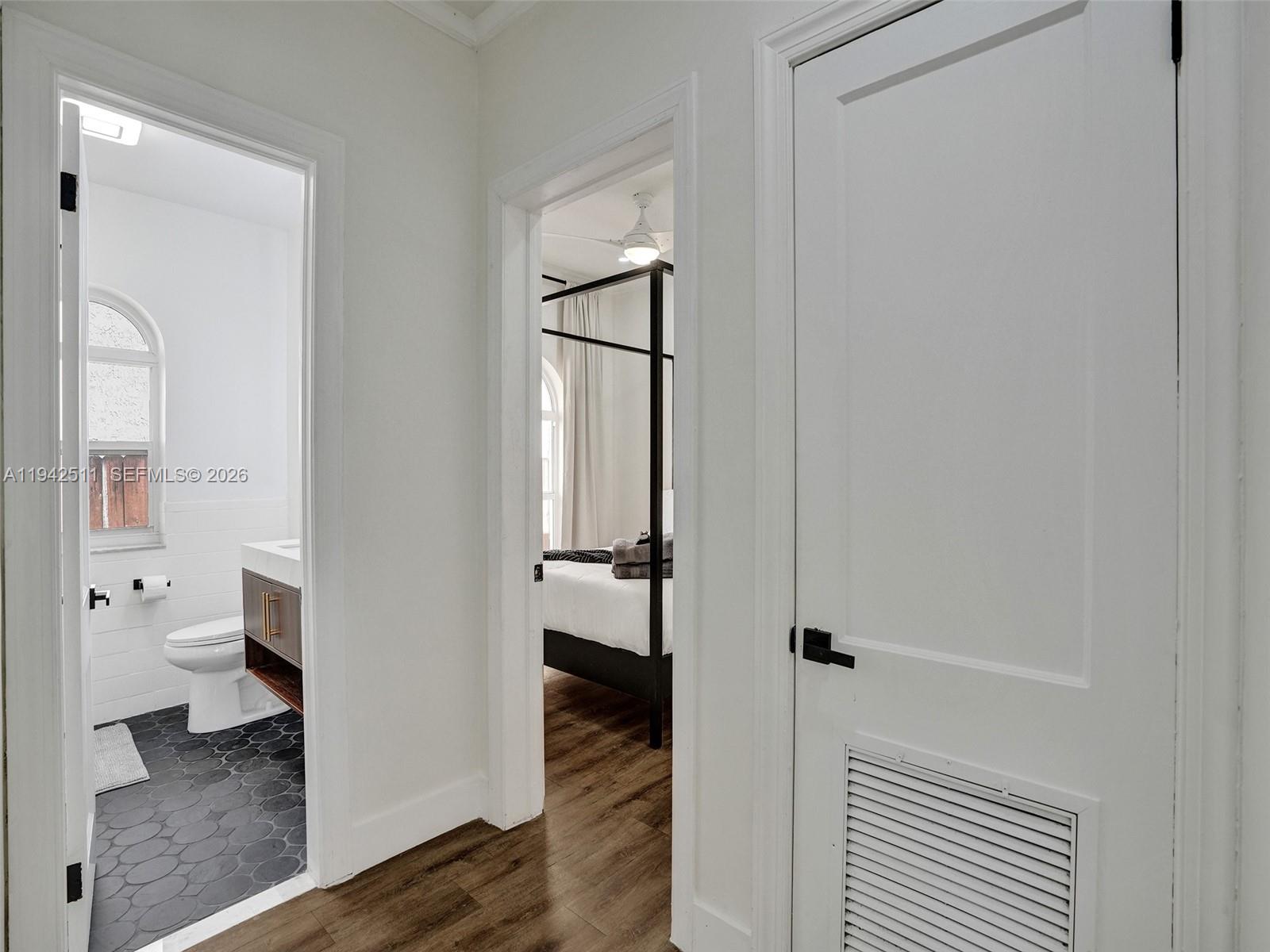 1128 Tyler Street Hollywood, FL 33019 - Photo 31 of 60 a bathroom with a toilet and a shower