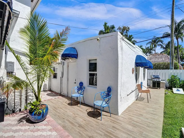 a kitchen with stainless steel appliances kitchen island granite countertop a refrigerator and a stove top oven