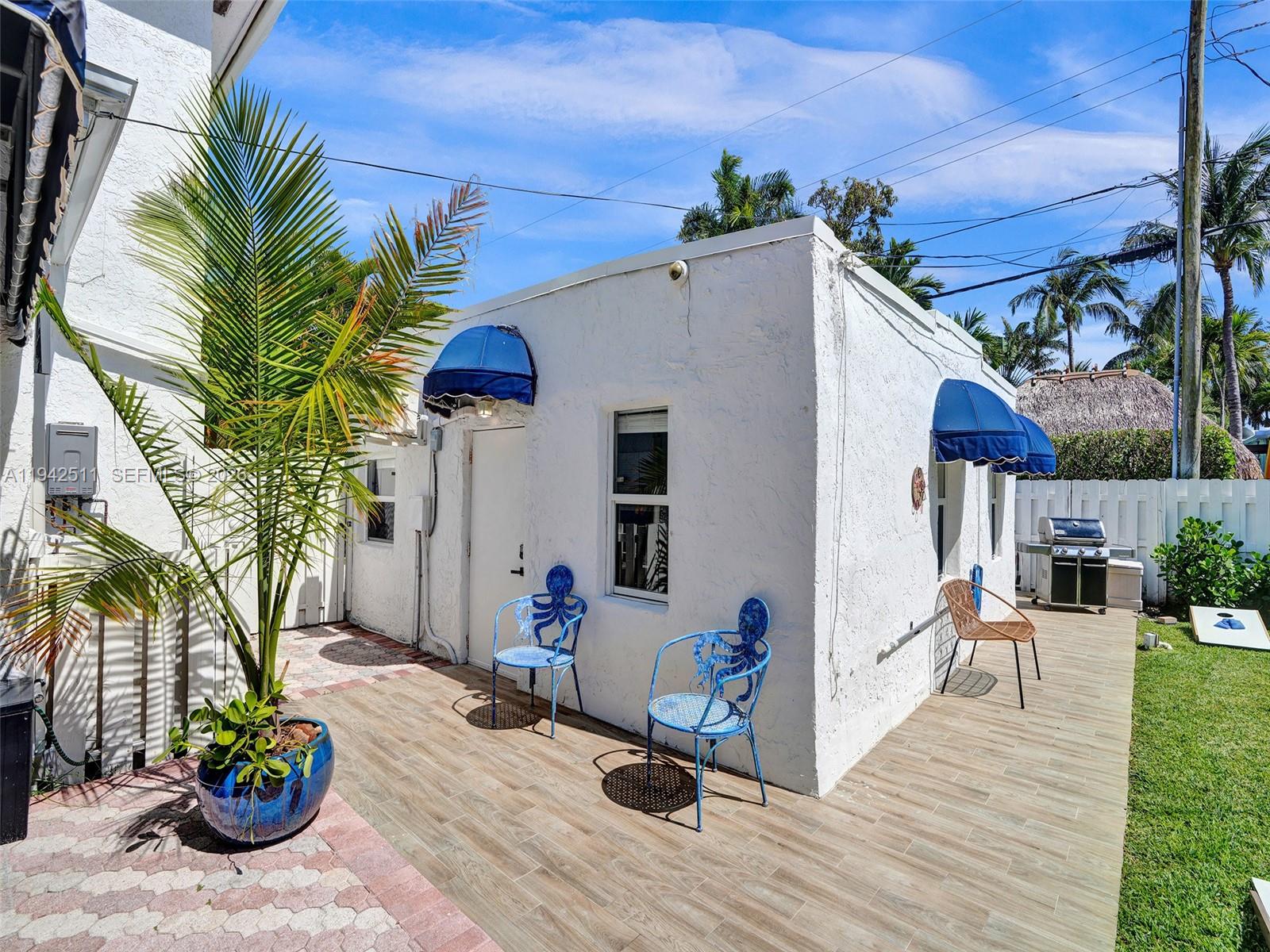 1128 Tyler Street Hollywood, FL 33019 - Photo 39 of 60 a view of a house with backyard and sitting area