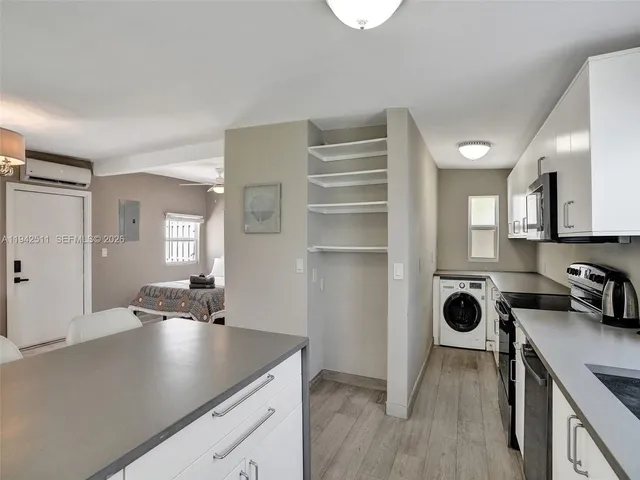 a front view of a house with garden and sitting area