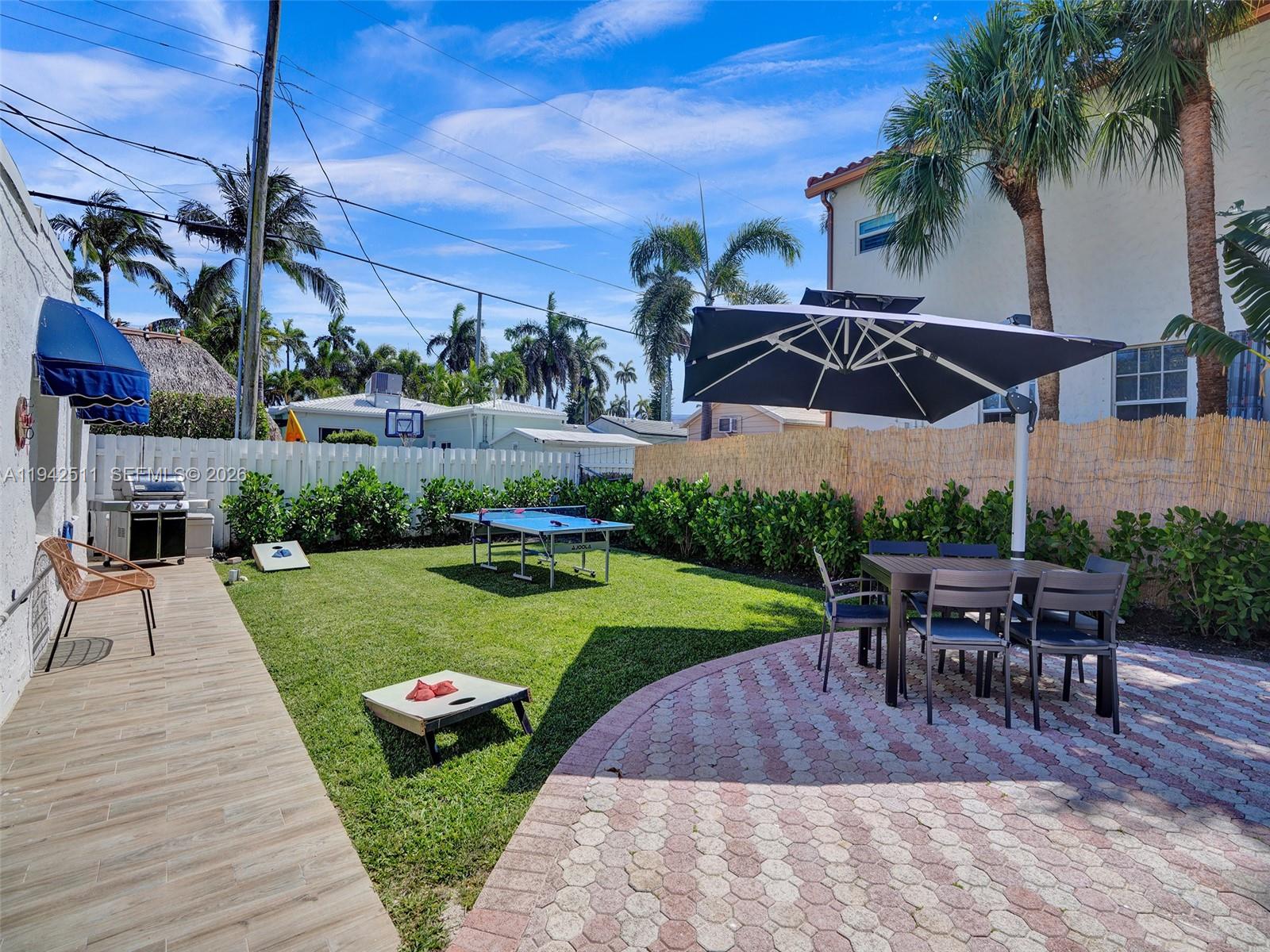 1128 Tyler Street Hollywood, FL 33019 - Photo 53 of 60 a view of a backyard with sitting area