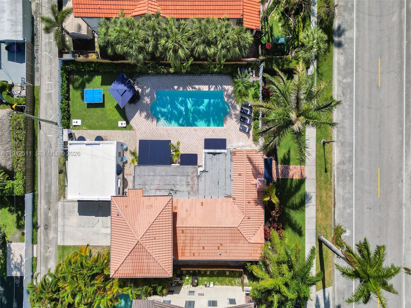 1128 Tyler Street Hollywood, FL 33019 - Photo 55 of 60 an aerial view of house with yard and outdoor seating