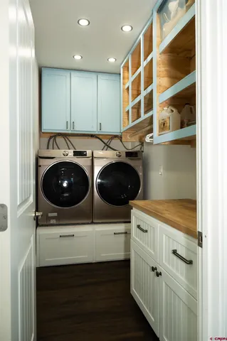 a kitchen with a sink a stove and cabinets