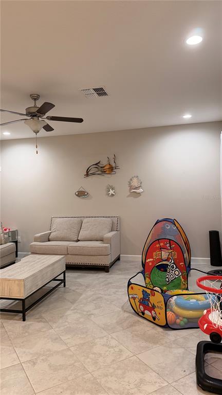 9909 Victory Gallop Loop Ruskin, FL 33573 - Photo 12 of 18 a living room with furniture