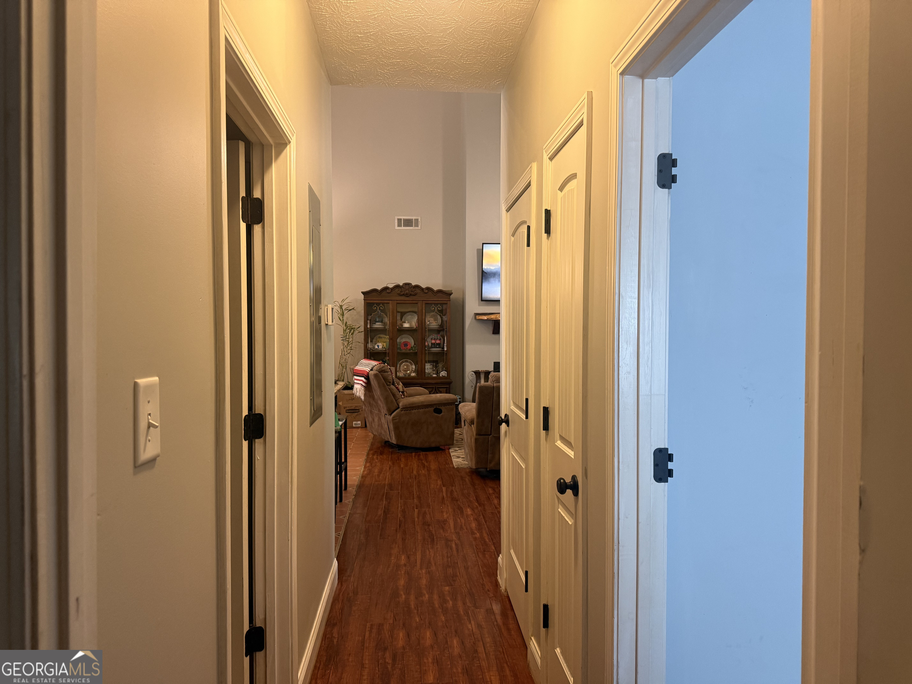 408 Bowen Road Milner, GA 30257 - Photo 14 of 36 a view of a hallway with a livingroom and a bathroom