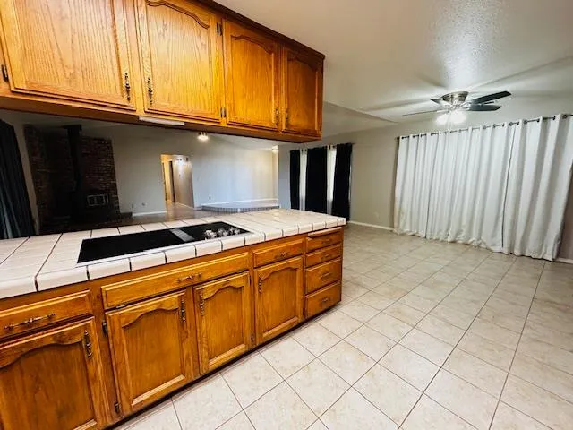 a kitchen with stainless steel appliances granite countertop a refrigerator a sink and dishwasher