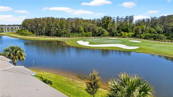 a view of a lake with a yard