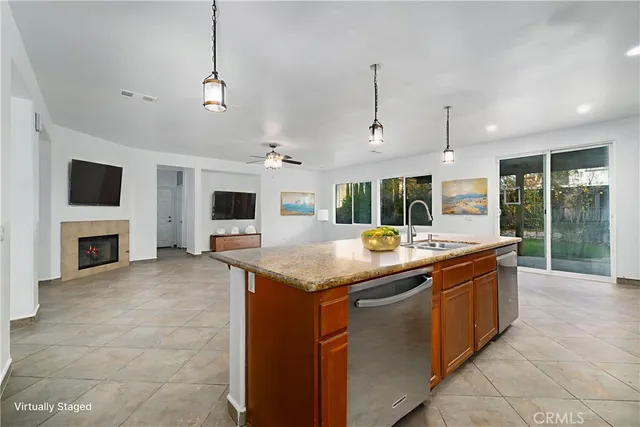 a kitchen with stainless steel appliances granite countertop stove top oven and cabinets