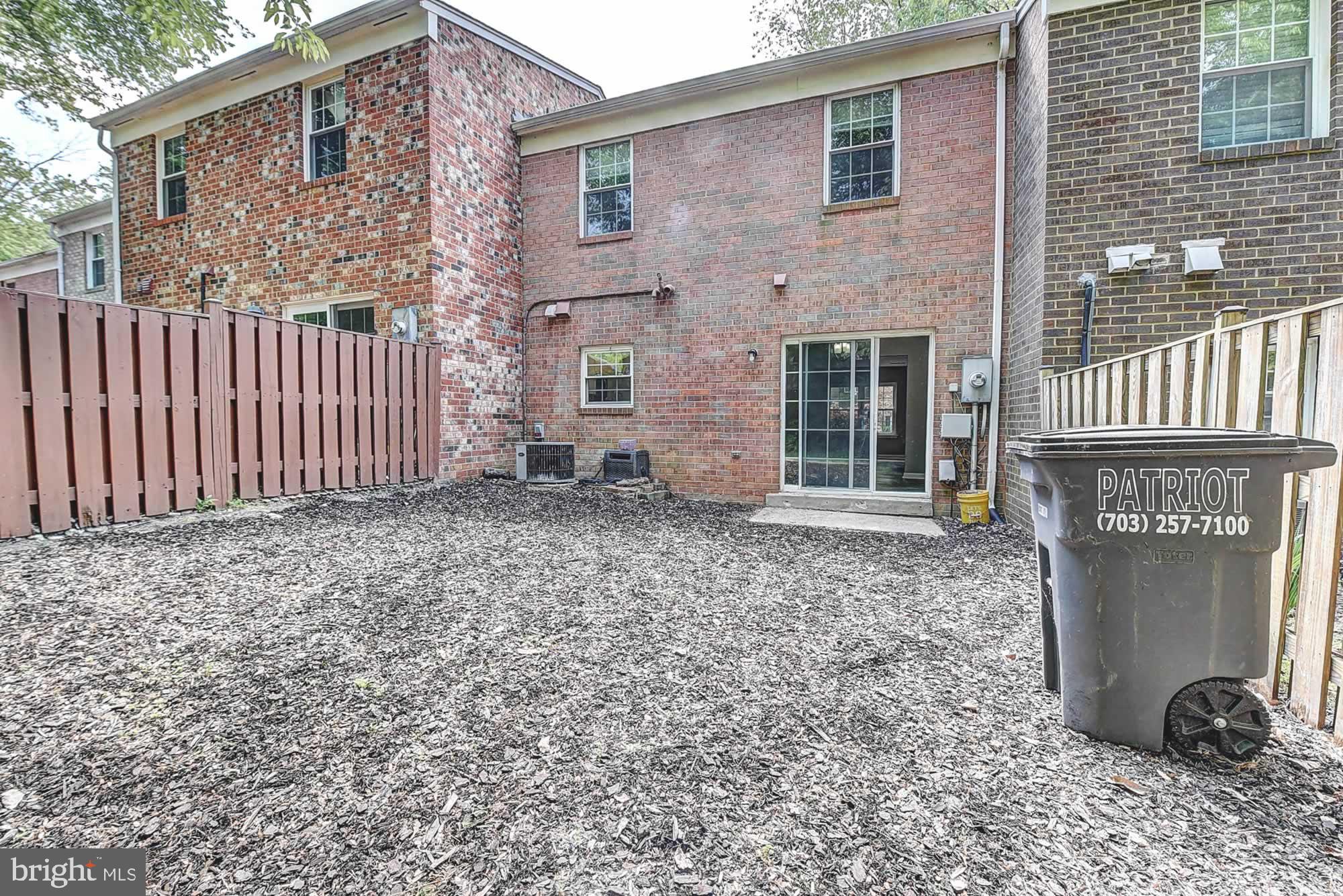 2226 Gunsmith Square Reston, VA 20191 - Photo 35 of 35 a front view of a house with garden