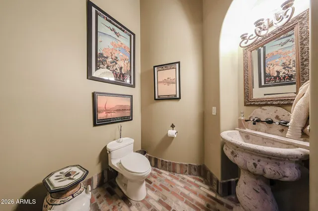 a living room with furniture a flat screen tv and a window