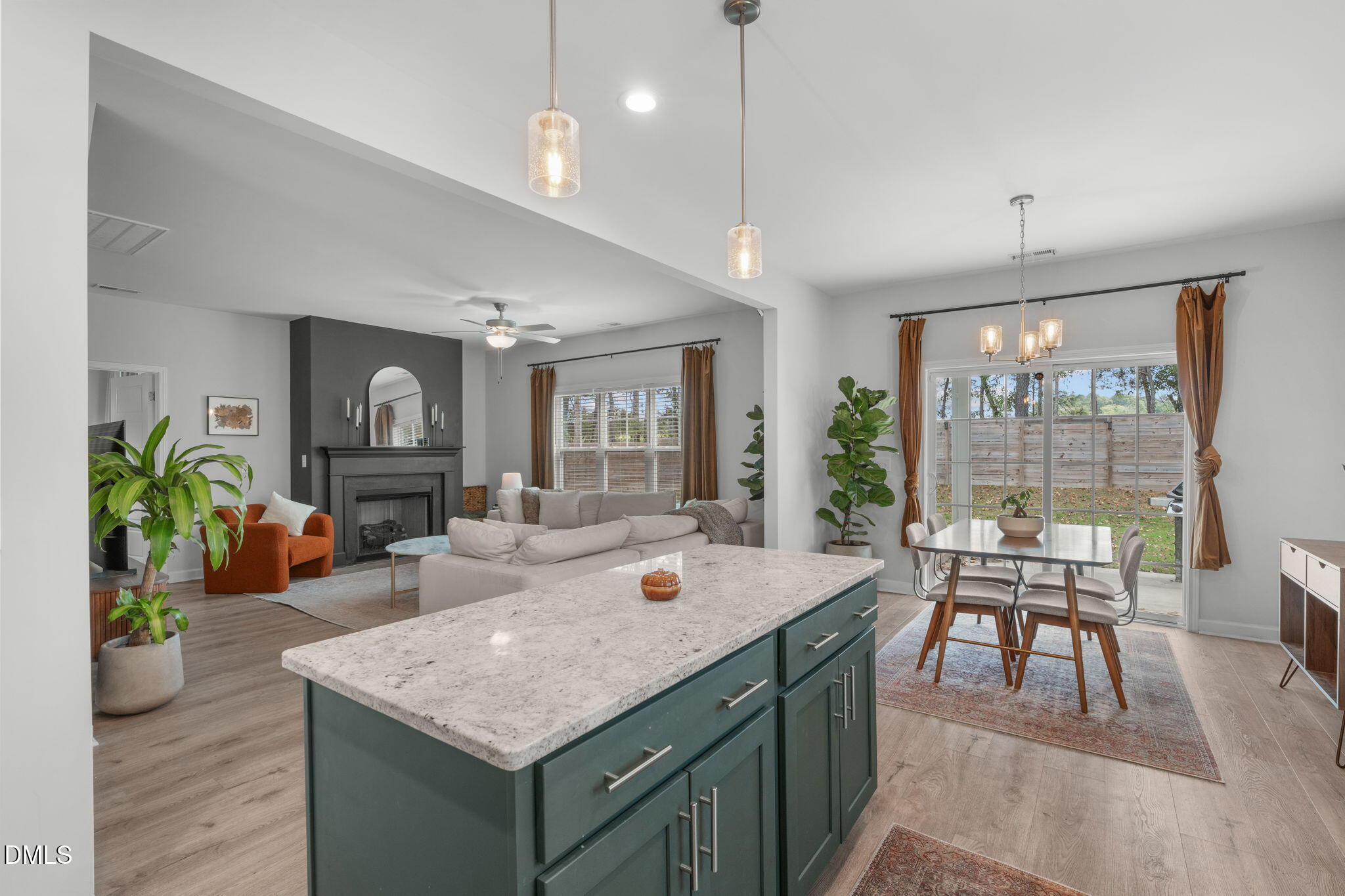 a living room with furniture a large window and a table