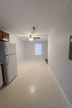 a view of a refrigerator in a kitchen