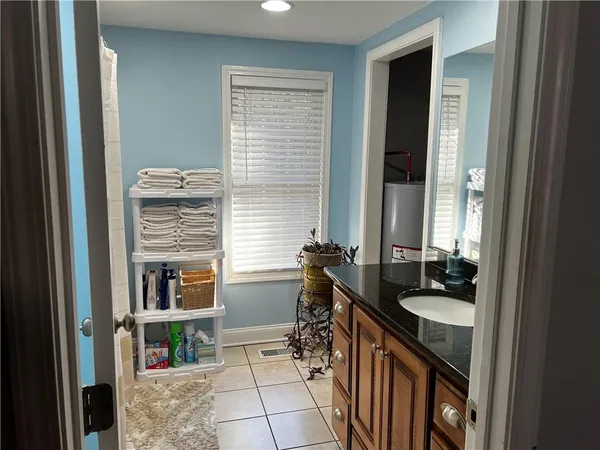a kitchen with a sink and a stove top oven