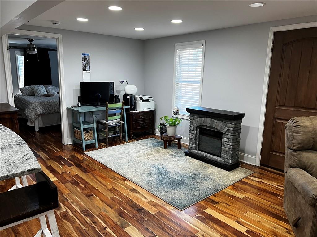 322 Goat Road Northwest Resaca, GA 30735 - Photo 6 of 16 a living room with furniture a flat screen tv and a fireplace