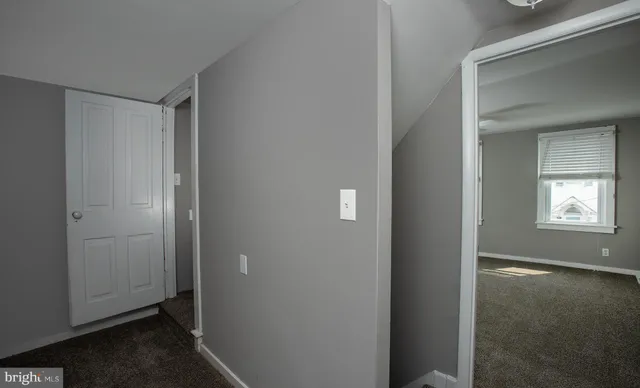 wooden floor in an empty room and a window