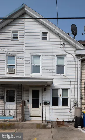 a front view of a house with glass windows
