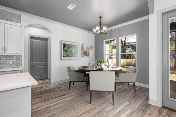 a view of a dining room with furniture window and wooden floor