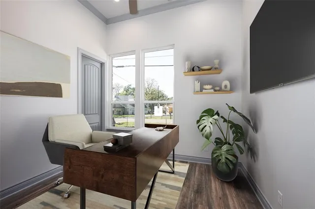 a living room with furniture and a potted plant