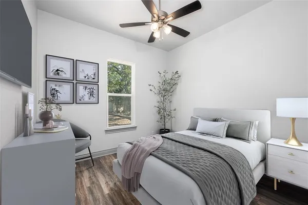 a bedroom with a bed furniture and a window