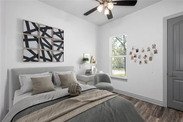 a bedroom with a large bed and a window