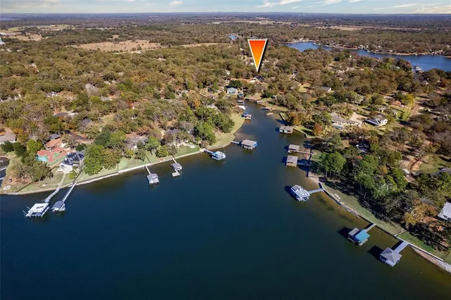 an aerial view of residential house with outdoor space and river