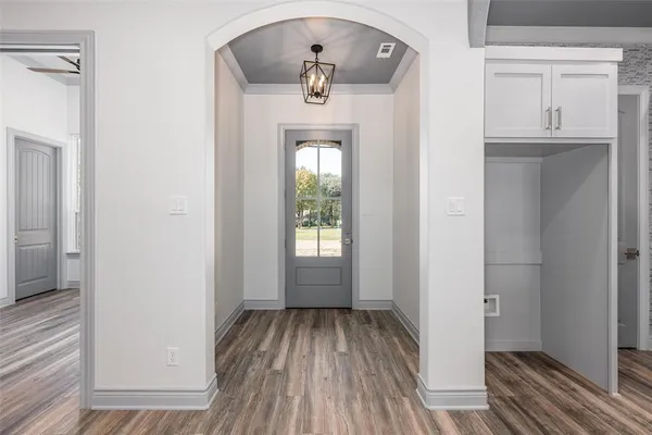 a view of a hallway view with wooden floor and staircase