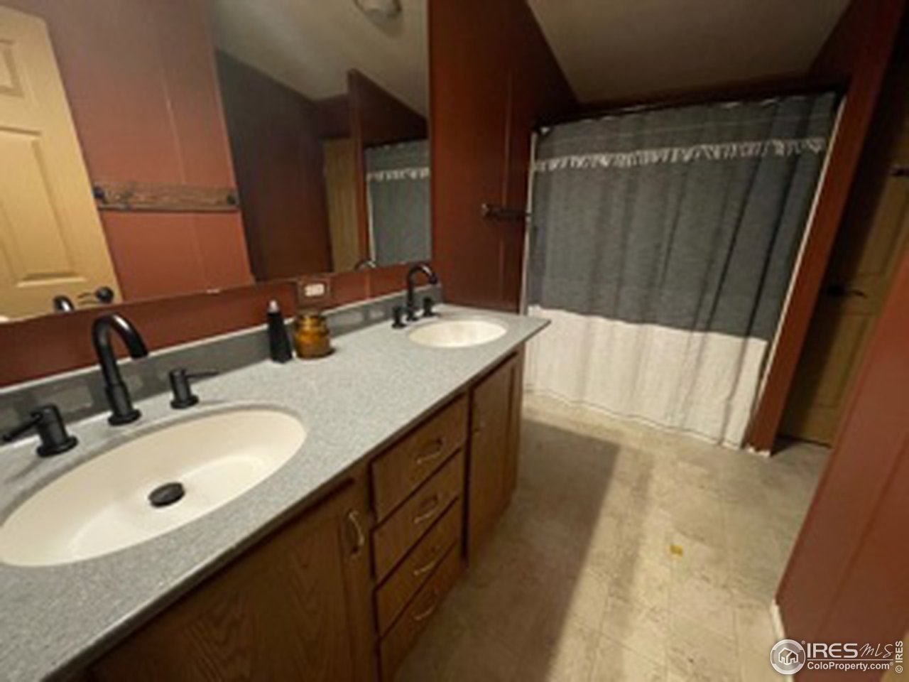 2500 East Harmony Road, Unit 62 Fort Collins, CO 80528 - Photo 9 of 13 a bathroom with a double vanity sink and a mirror