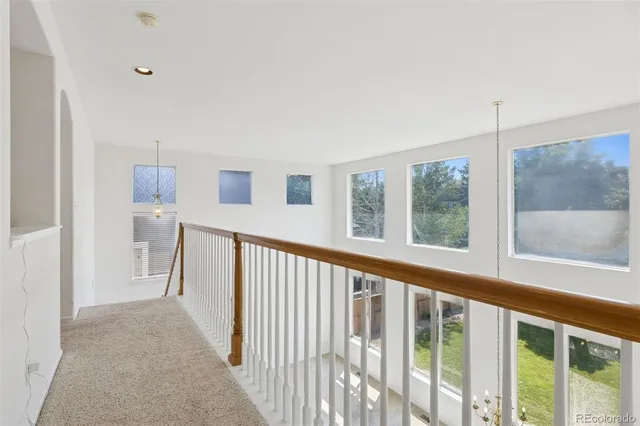 a view of a hallway with windows