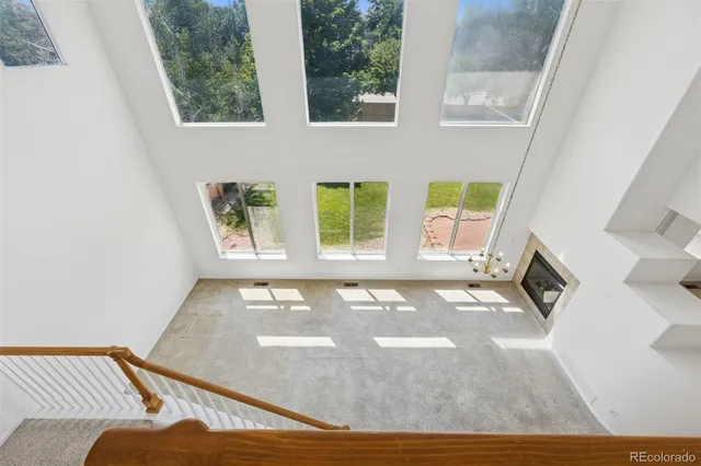 a view of a bedroom with furniture and windows