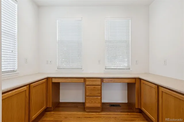 a view of a kitchen cabinets and a window
