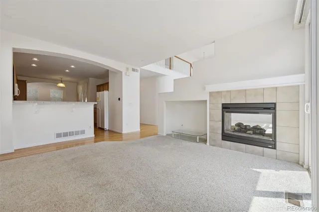an empty room with fire place and a fireplace