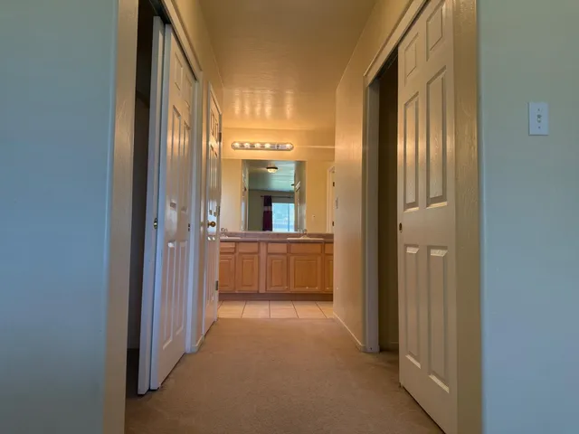 a view of a bathroom from the hallway