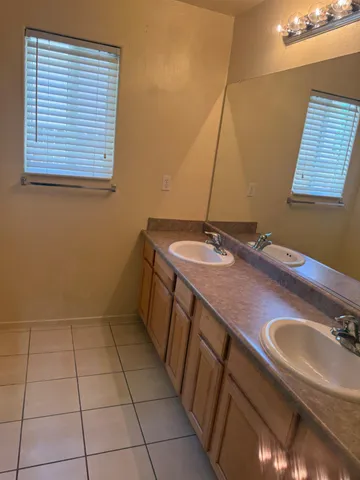 a bathroom with a sink a vanity and a mirror