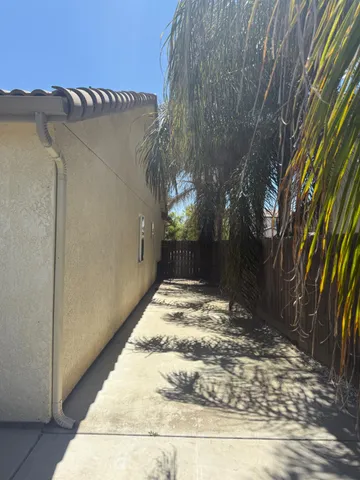 a house with swimming pool in front of it