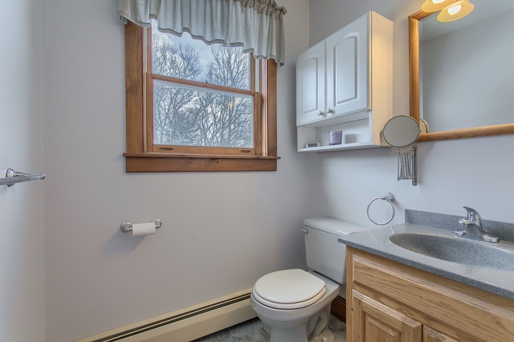 253 New Boston Road Sturbridge, MA 01566 - Photo 11 of 30 a bathroom with a sink a toilet and vanity