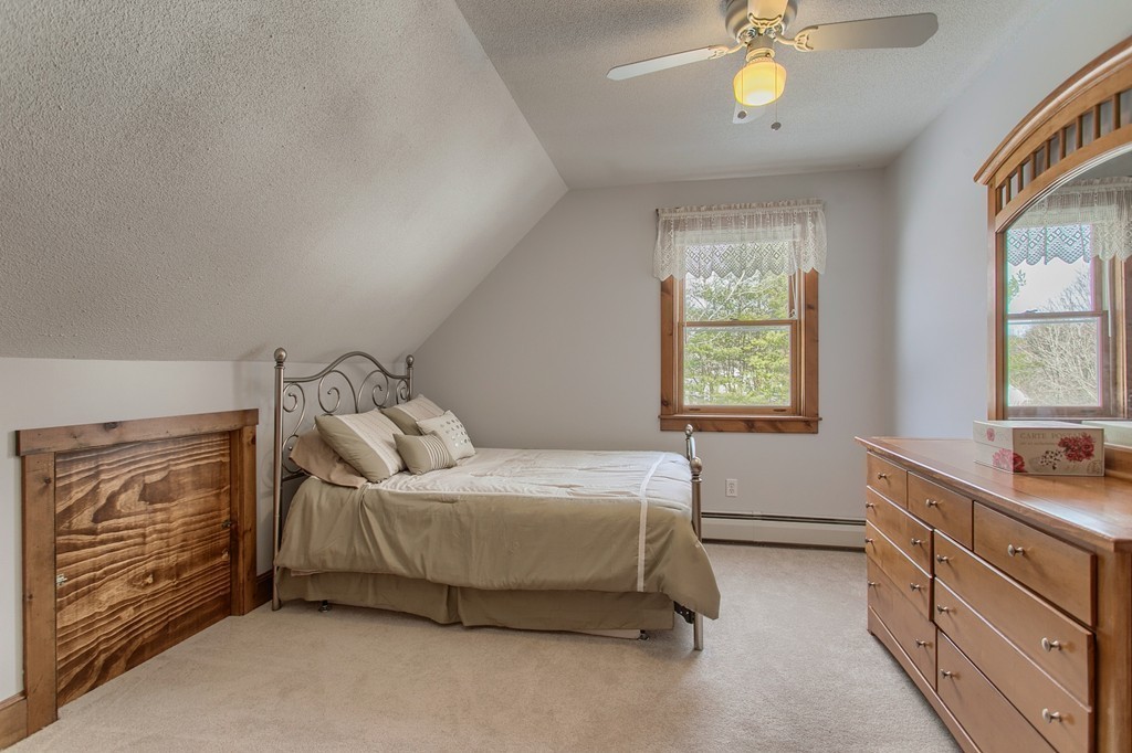 253 New Boston Road Sturbridge, MA 01566 - Photo 15 of 30 a bedroom with a bed and a window