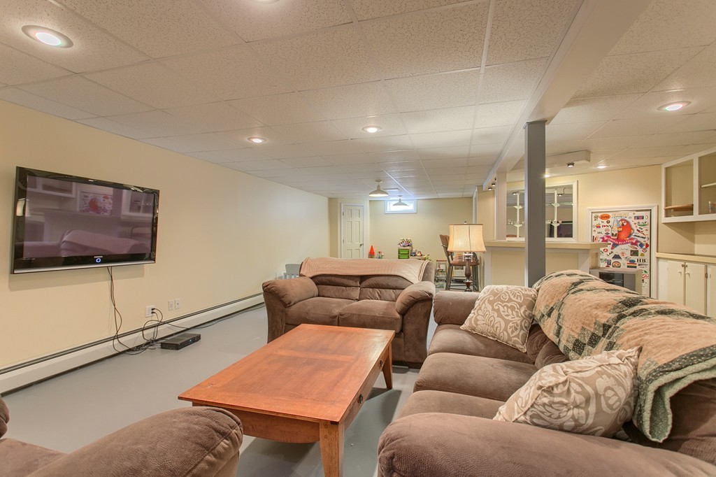 253 New Boston Road Sturbridge, MA 01566 - Photo 18 of 30 a living room with furniture and a flat screen tv