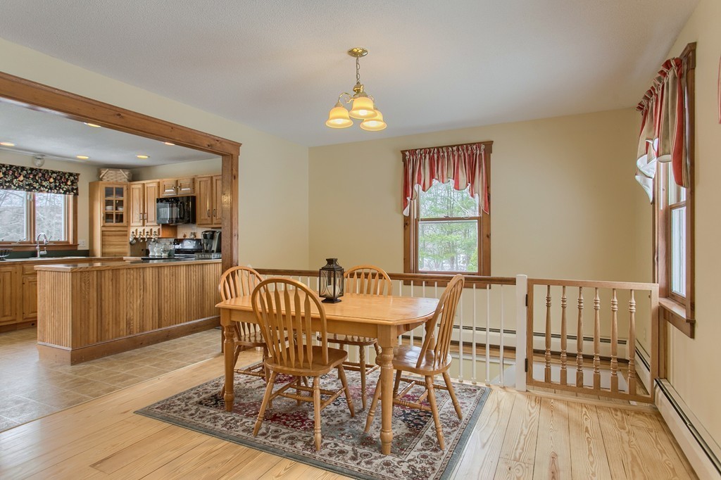 253 New Boston Road Sturbridge, MA 01566 - Photo 7 of 30 a view of a dining room with furniture window and wooden floor