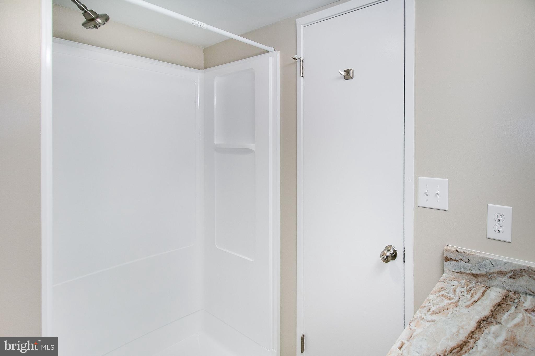 5901 Mt Eagle Drive, Unit 1101 Alexandria, VA 22303 - Photo 26 of 44 Gleaming stall shower in the 2nd BA.