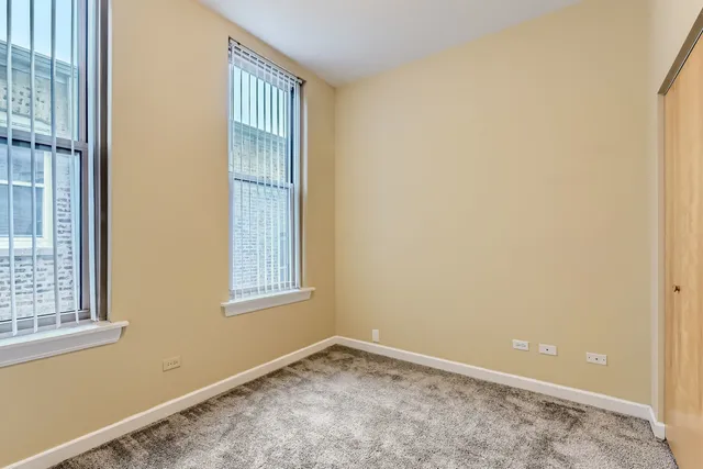 a bathroom with a toilet sink shower and mirror