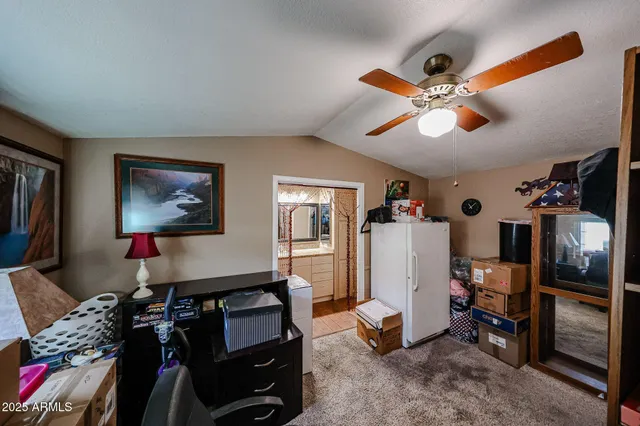 a room with gym equipment and a flat screen tv