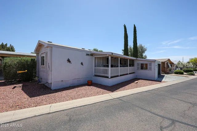 a view of a house with a backyard